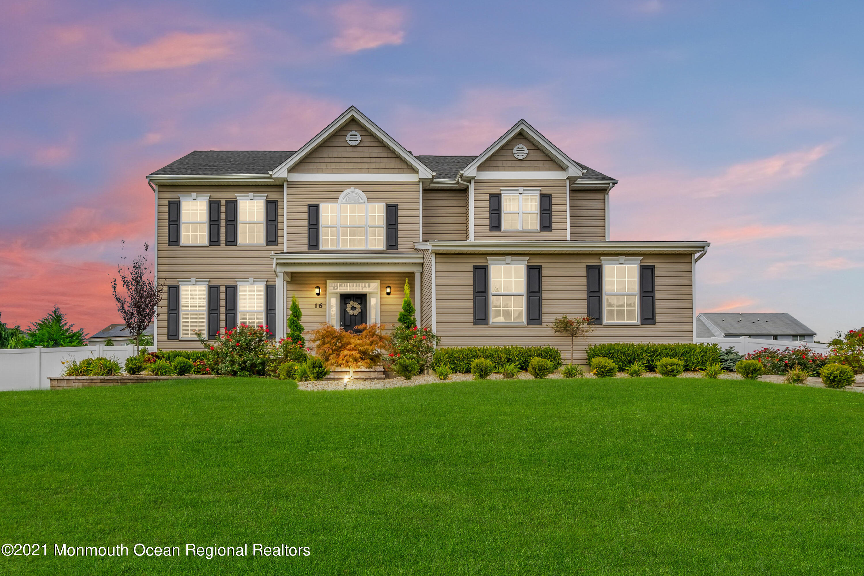 16 Bellagio Road Jackson, NJ 08527 - Photo 1 of 46 a front view of a house with a garden and yard
