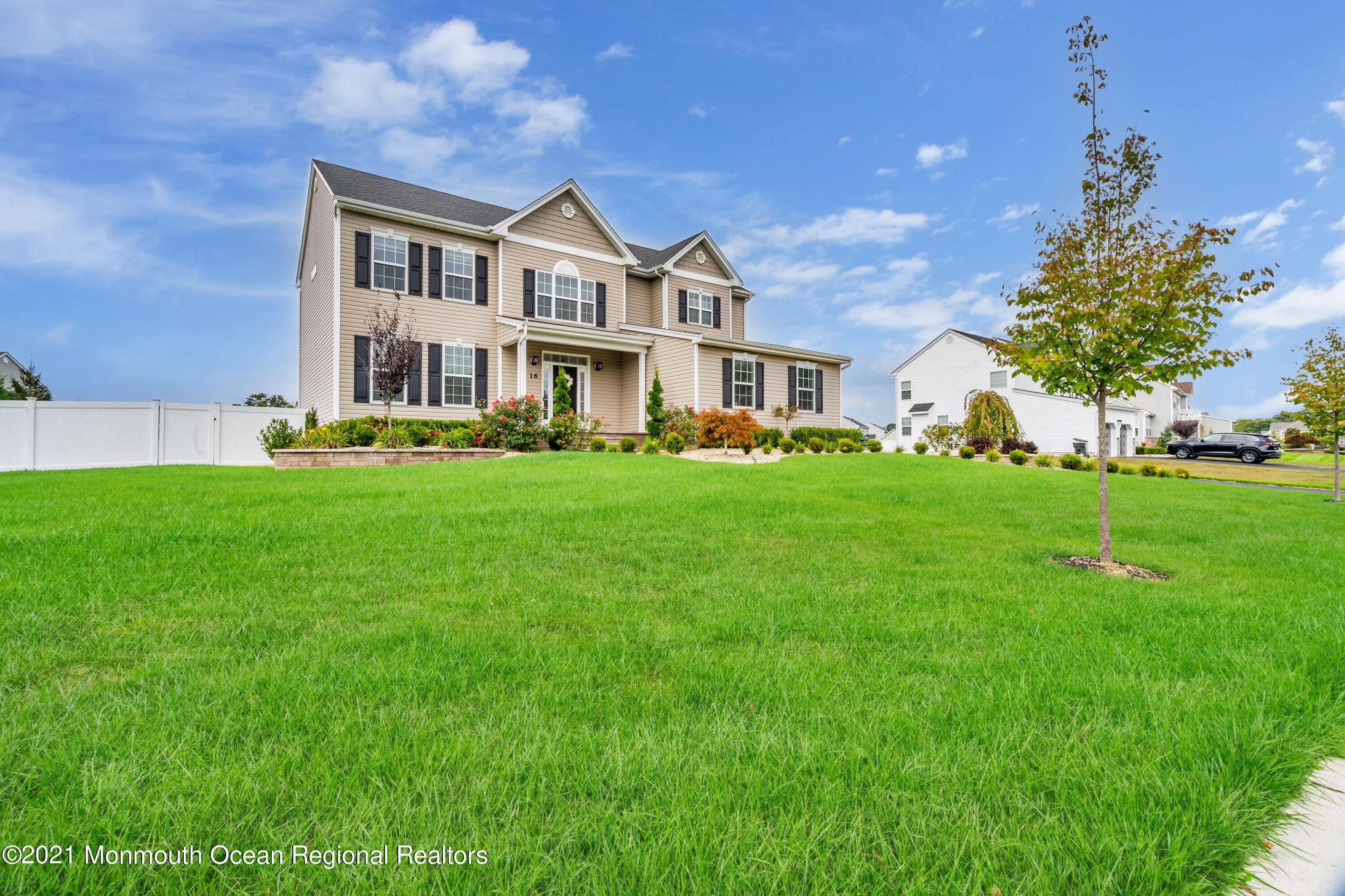 16 Bellagio Road Jackson, NJ 08527 - Photo 2 of 46 a front view of a house with a garden