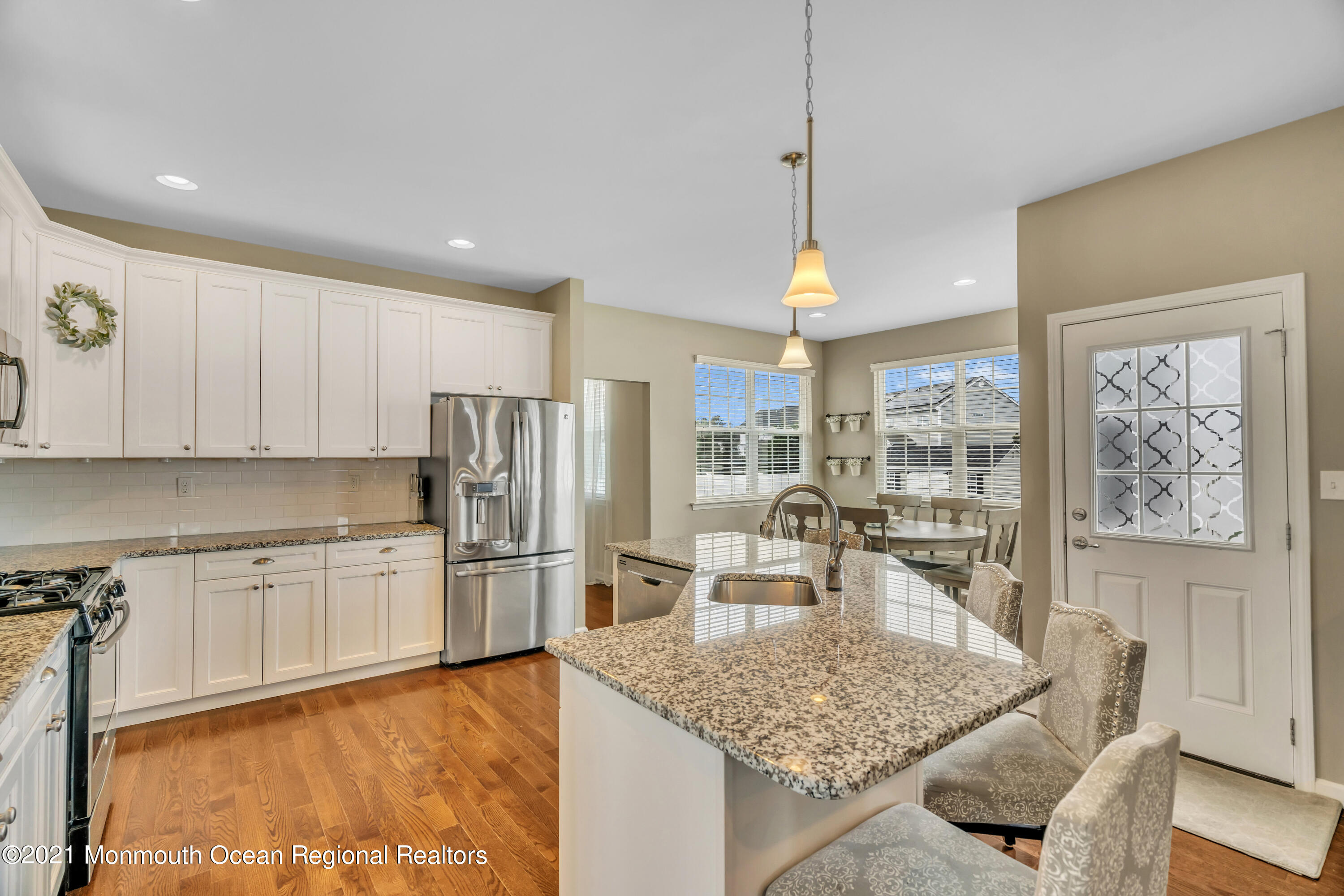 16 Bellagio Road Jackson, NJ 08527 - Photo 14 of 46 a kitchen with stainless steel appliances granite countertop a sink refrigerator and cabinets