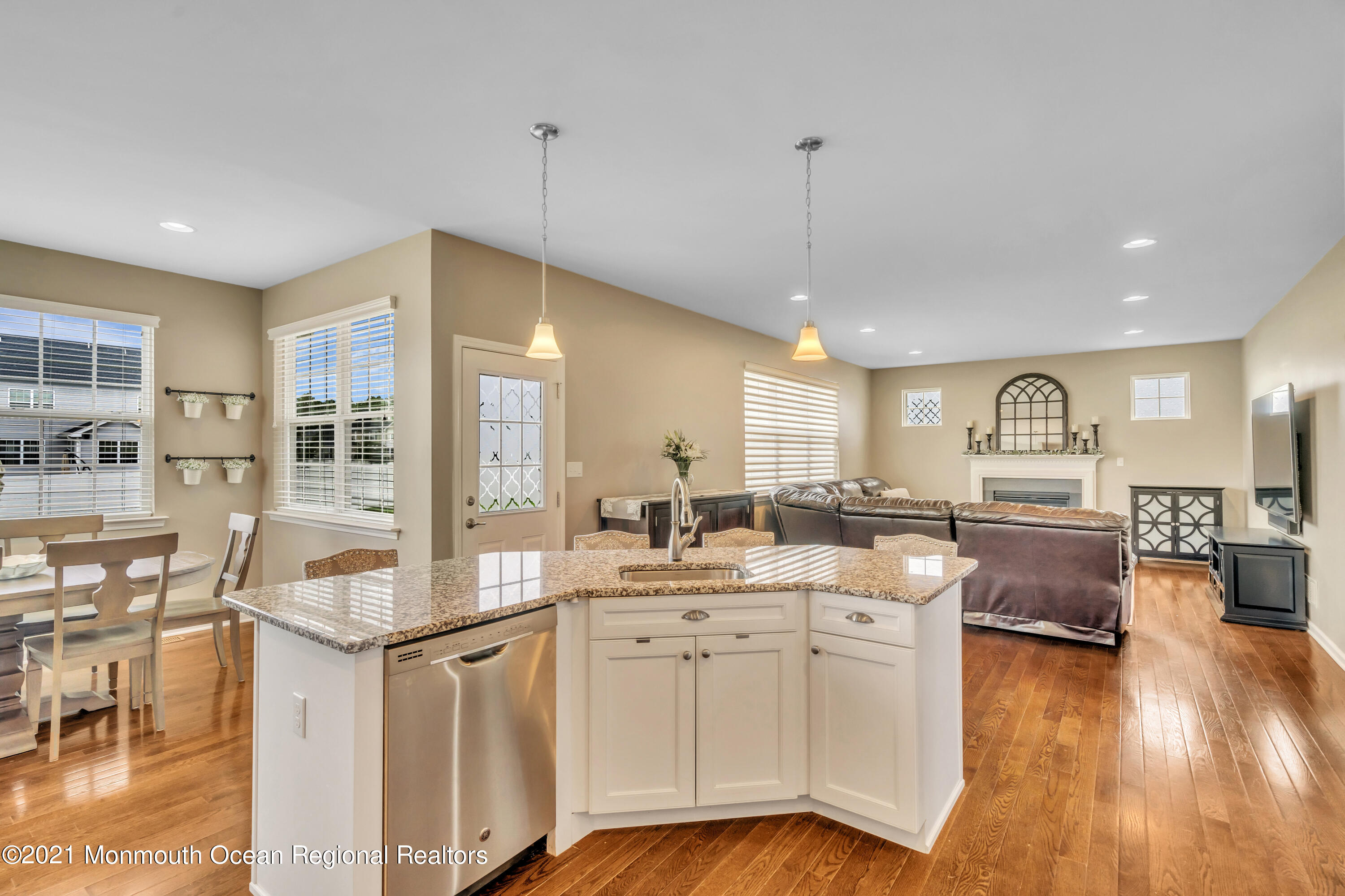 16 Bellagio Road Jackson, NJ 08527 - Photo 17 of 46 a large white kitchen with lots of counter space and chandelier