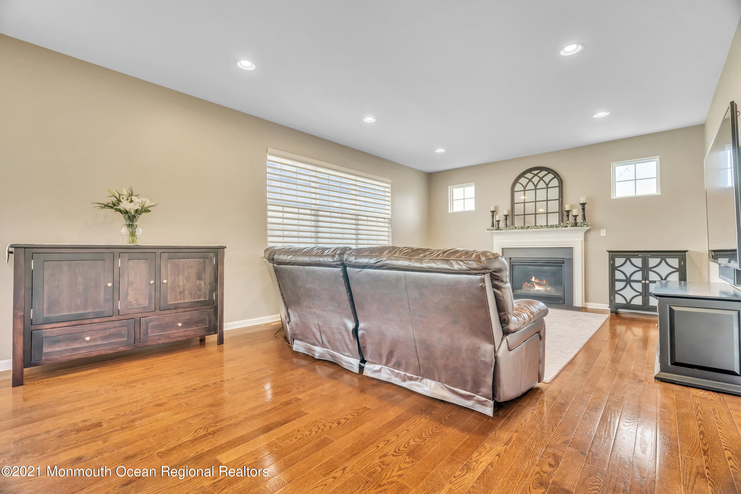 16 Bellagio Road Jackson, NJ 08527 - Photo 22 of 46 a living room with furniture and a fireplace