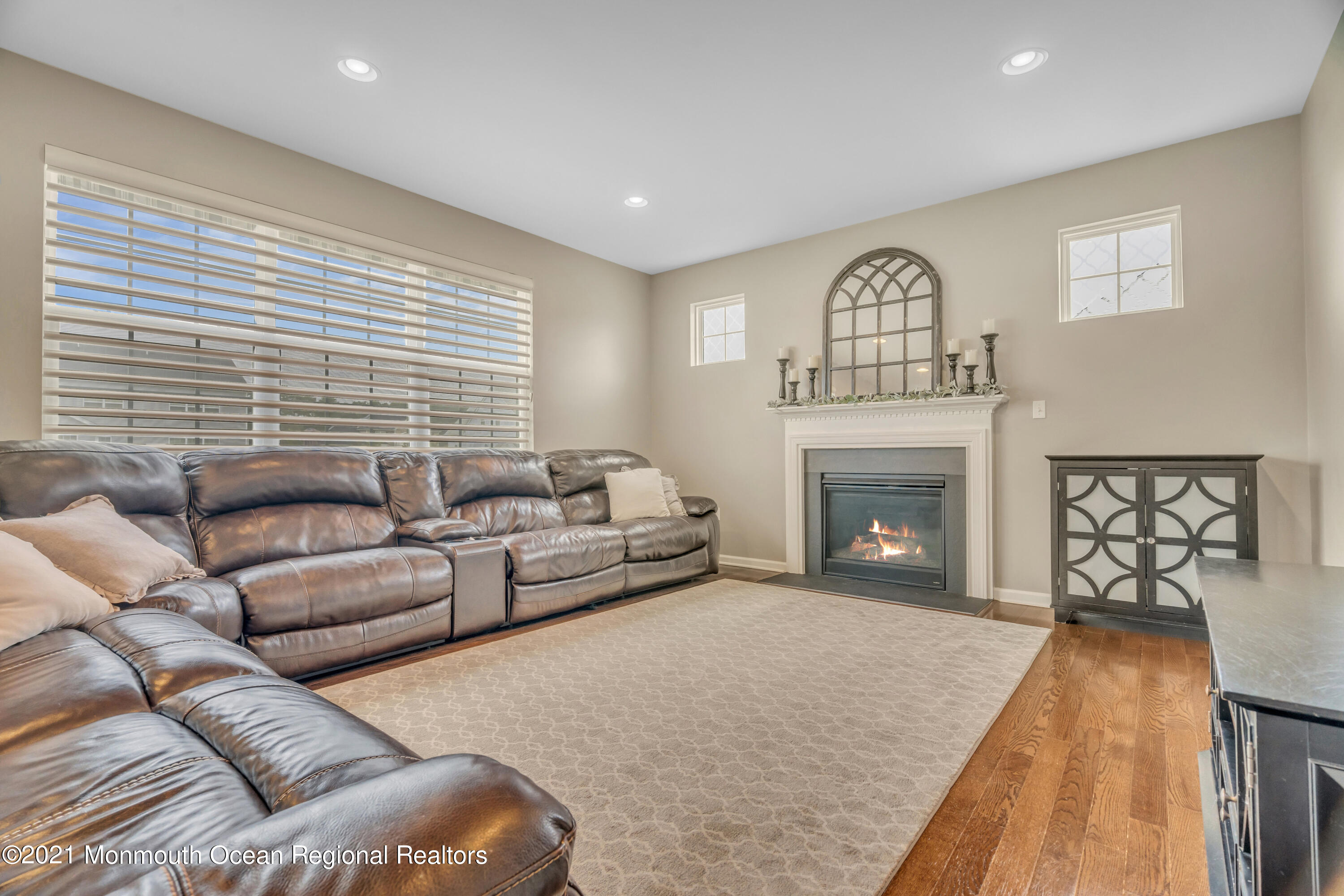 16 Bellagio Road Jackson, NJ 08527 - Photo 23 of 46 a living room with furniture and a fireplace