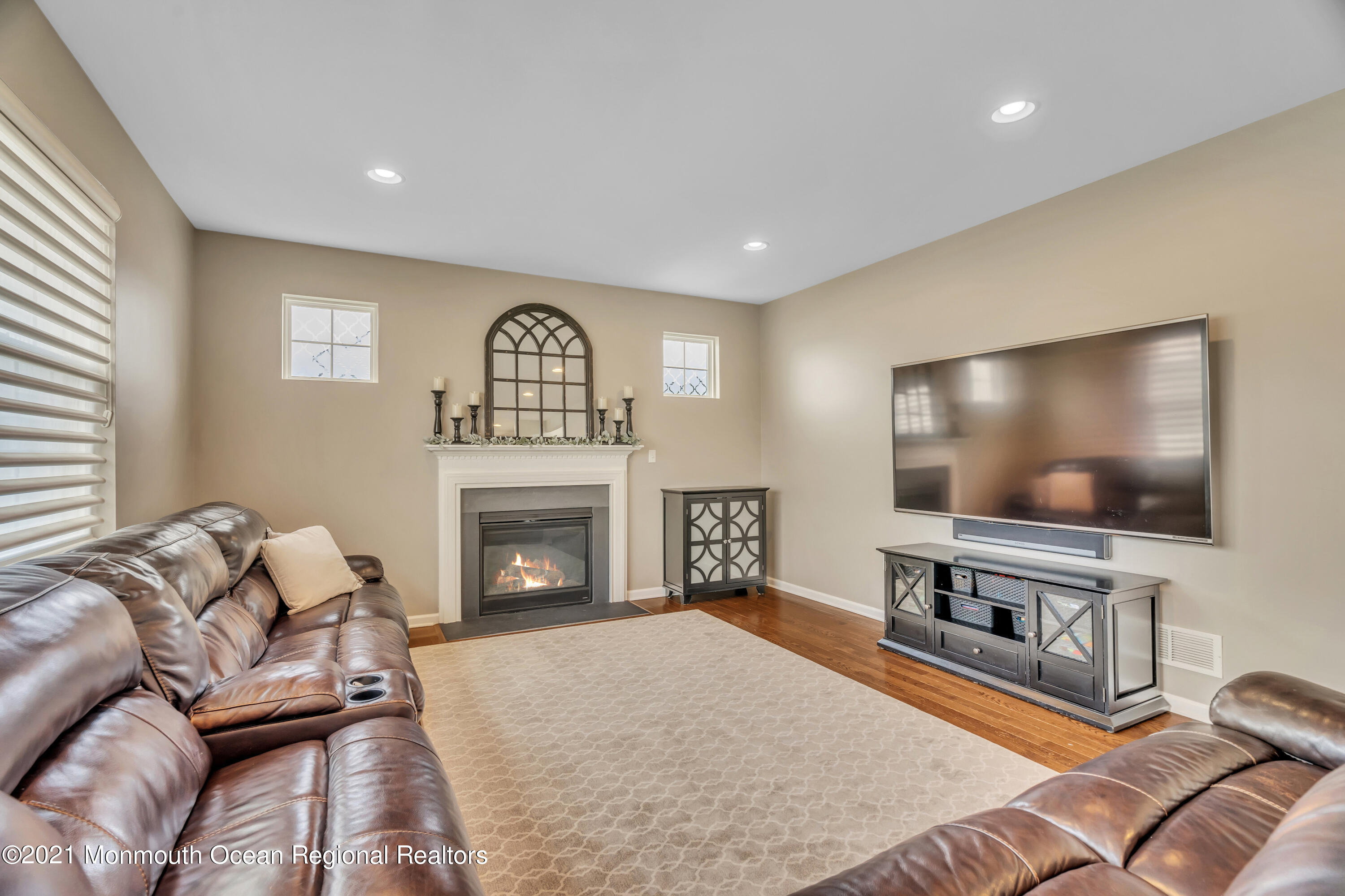 16 Bellagio Road Jackson, NJ 08527 - Photo 24 of 46 a living room with furniture and a flat screen tv