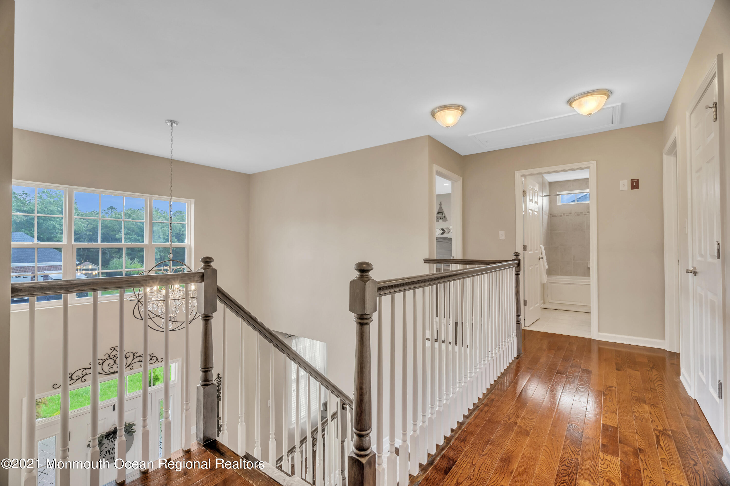 16 Bellagio Road Jackson, NJ 08527 - Photo 30 of 46 a view of a hallway with wooden floor and stairs