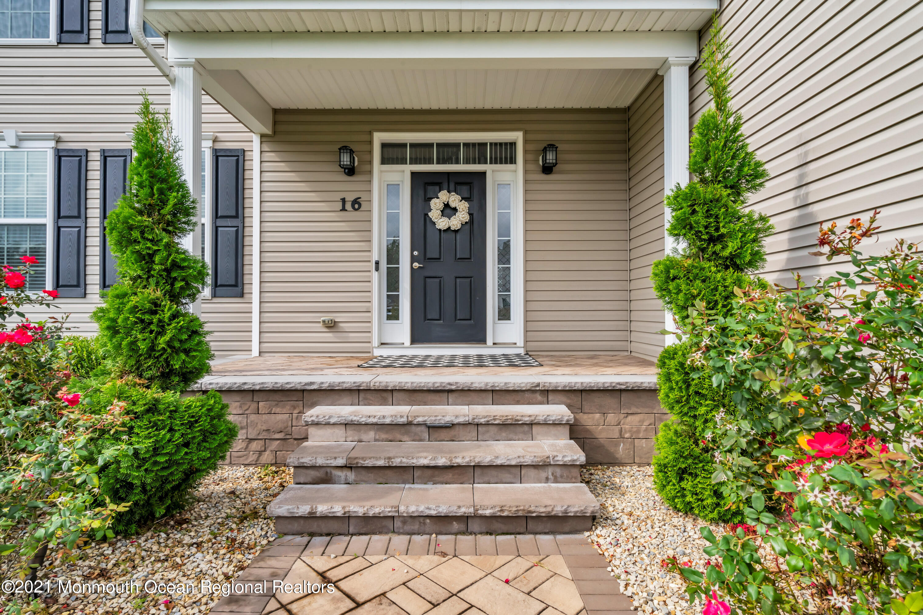 16 Bellagio Road Jackson, NJ 08527 - Photo 4 of 46 a front view of a house with plants