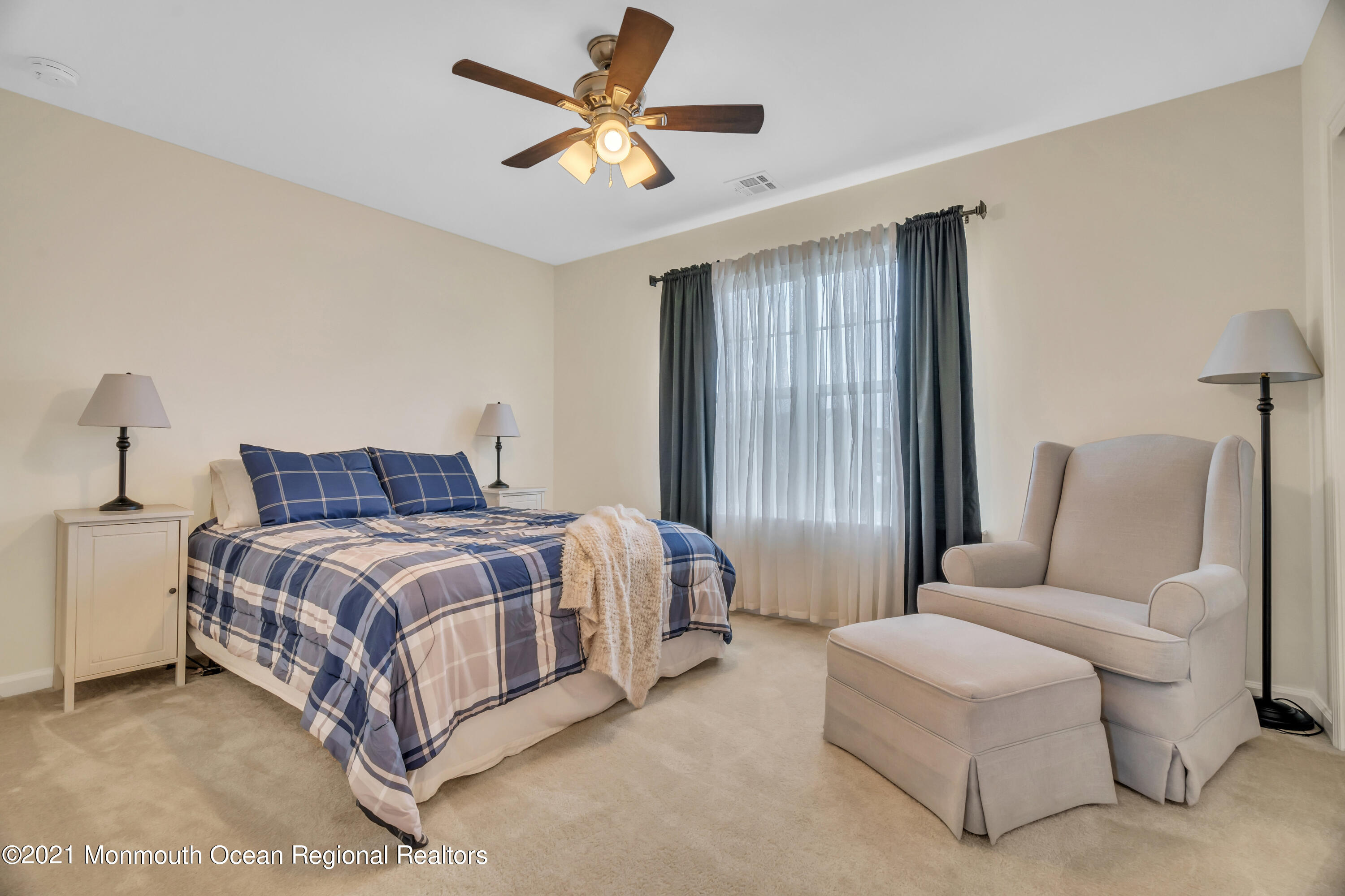 16 Bellagio Road Jackson, NJ 08527 - Photo 33 of 46 a spacious bedroom with a bed and a chandelier