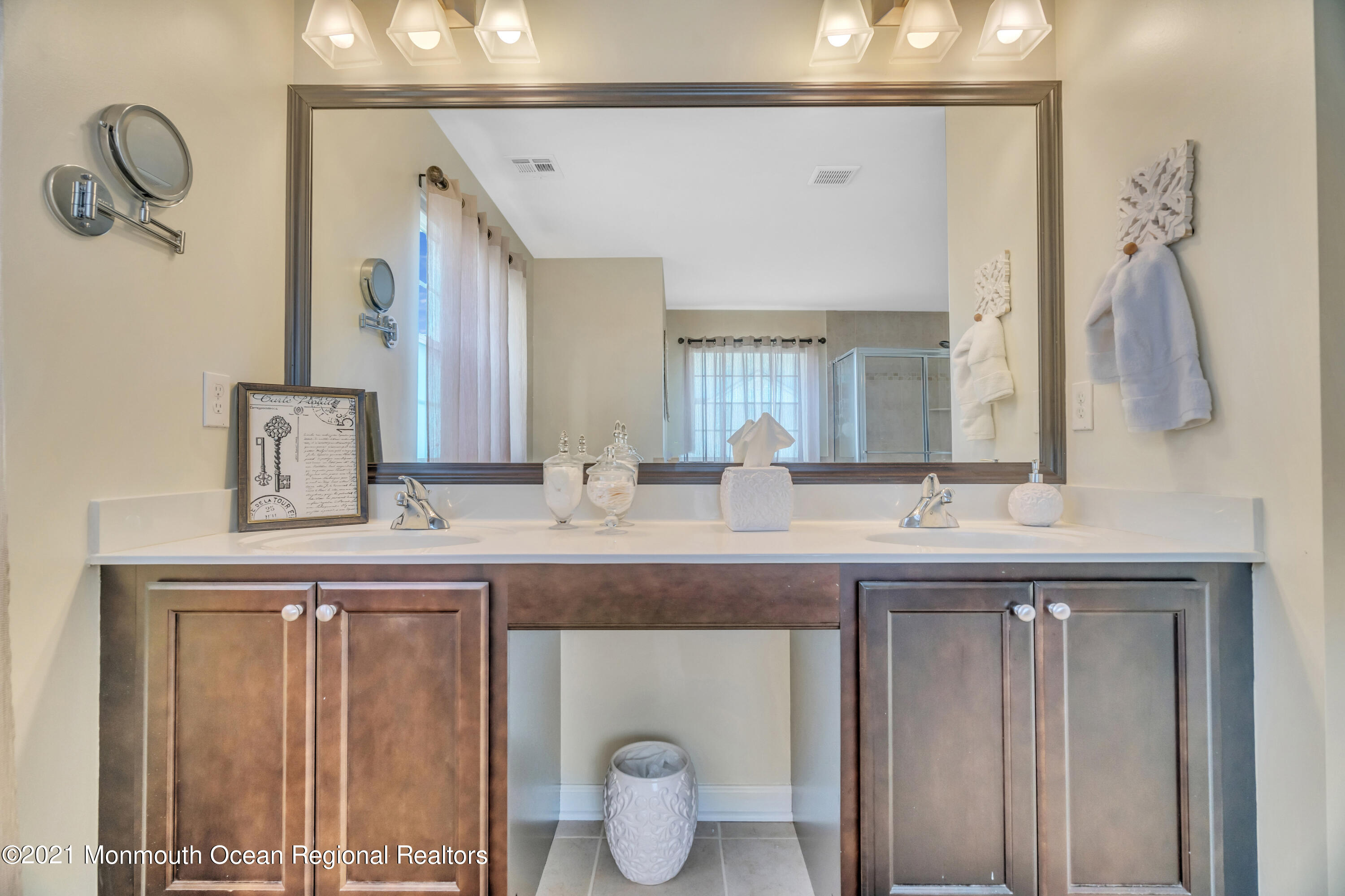 16 Bellagio Road Jackson, NJ 08527 - Photo 37 of 46 a bathroom with a sink and a mirror