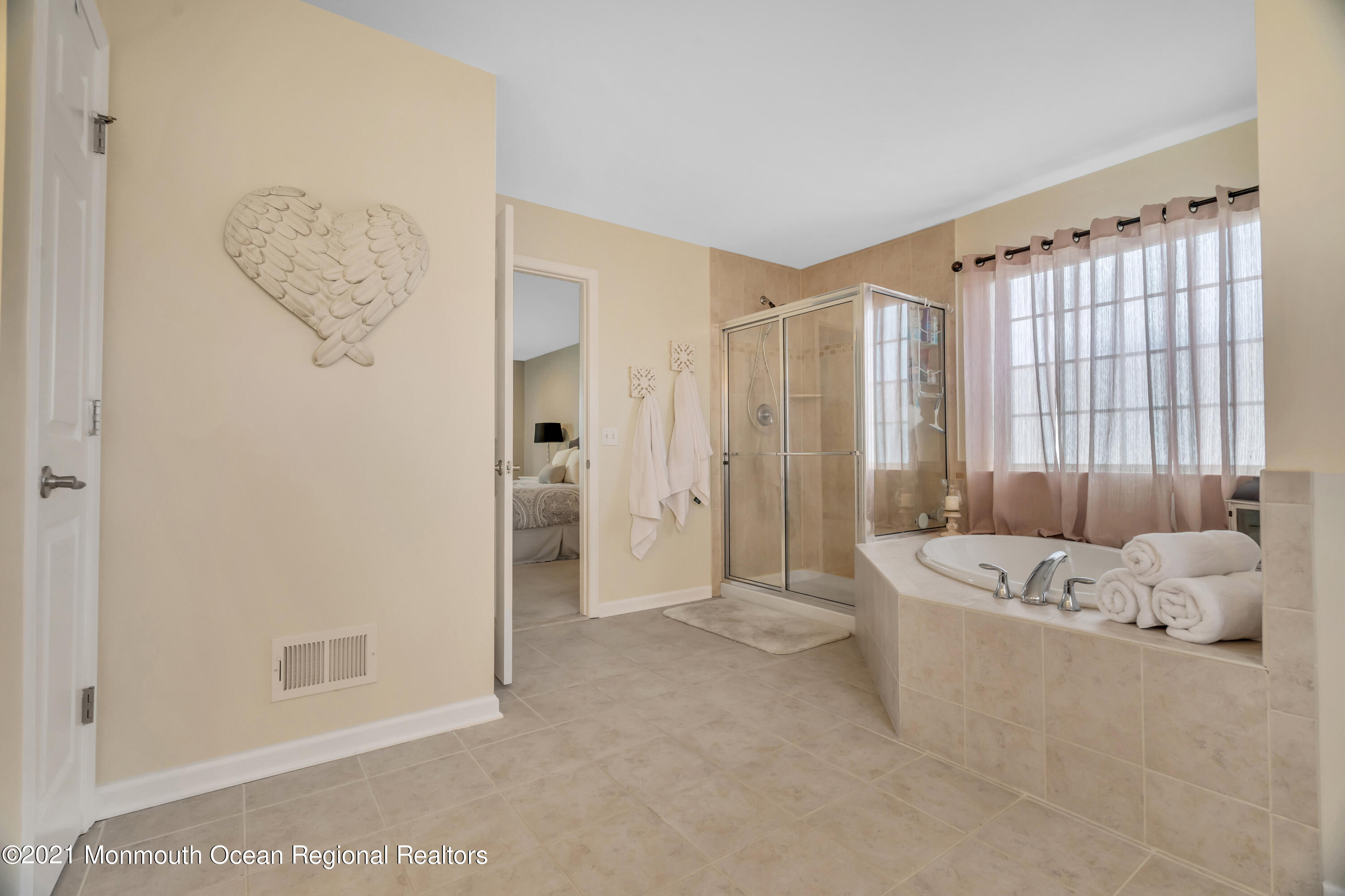 16 Bellagio Road Jackson, NJ 08527 - Photo 39 of 46 a spacious bathroom with a tub shower and sink