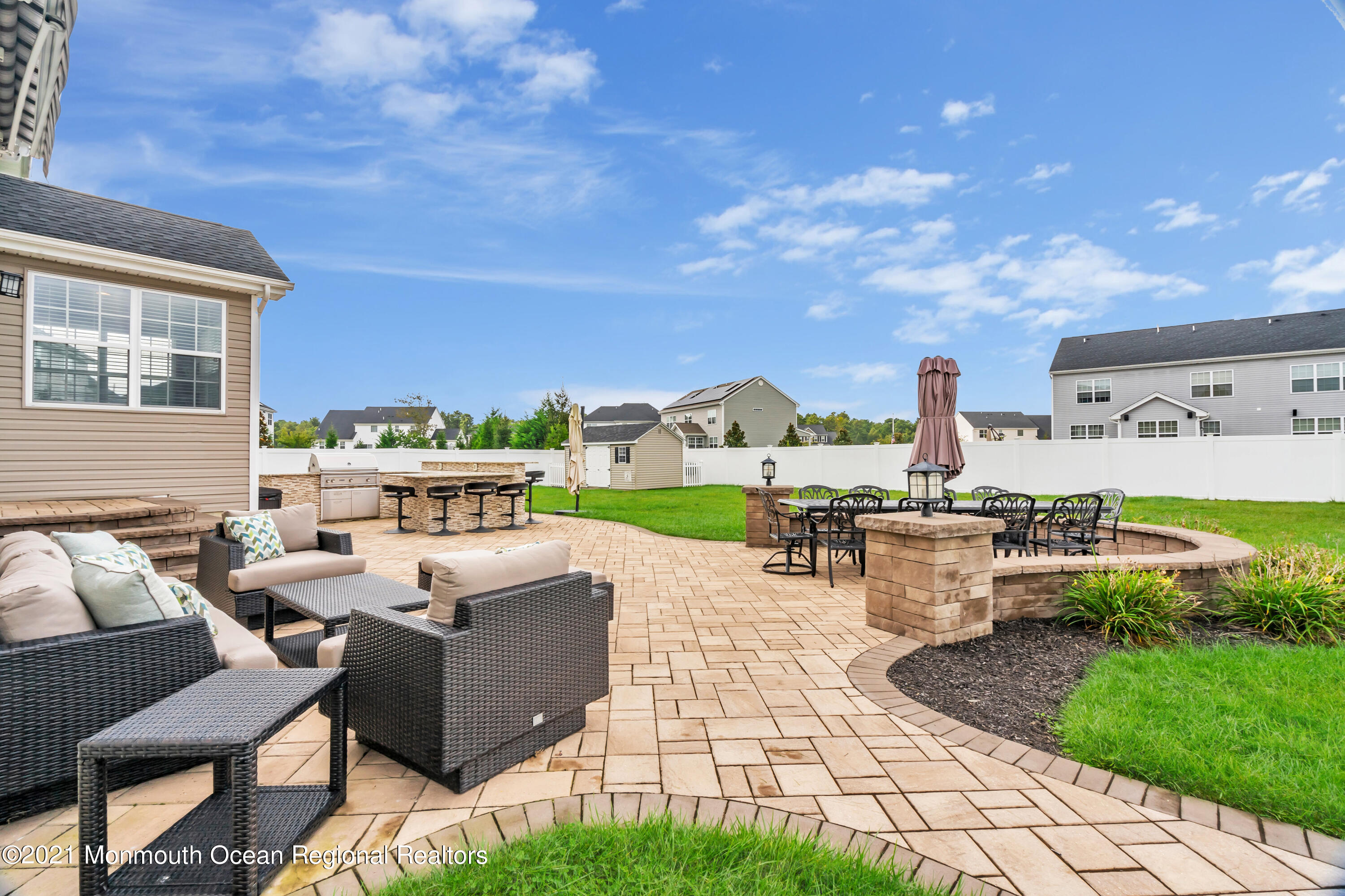 16 Bellagio Road Jackson, NJ 08527 - Photo 44 of 46 a view of a patio with table and chairs and potted plants