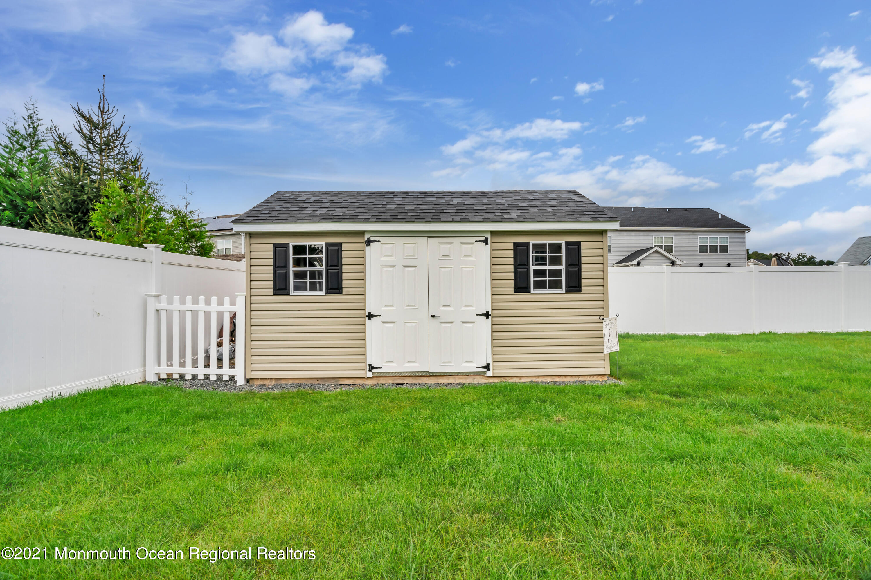 16 Bellagio Road Jackson, NJ 08527 - Photo 45 of 46 a front view of a house with a garden