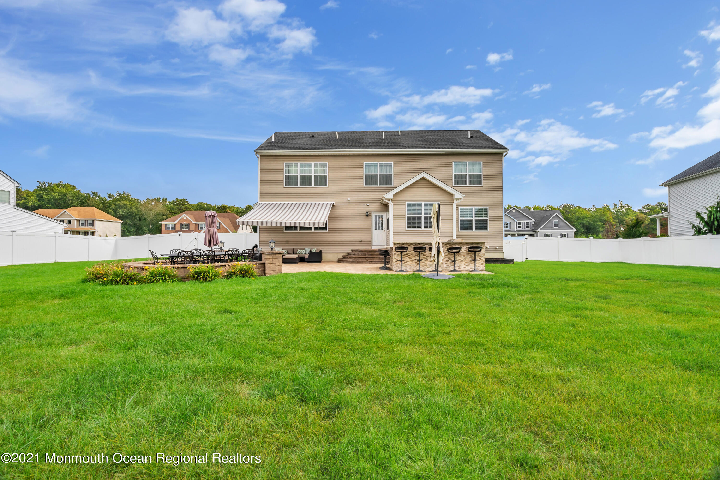 16 Bellagio Road Jackson, NJ 08527 - Photo 46 of 46 a front view of house with yard and outdoor seating