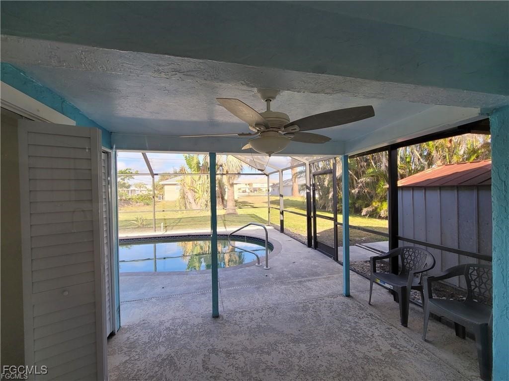 4530 Southwest 7th Place, Unit B Cape Coral, FL 33914 - Photo 14 of 18 a view of a porch with chairs and backyard