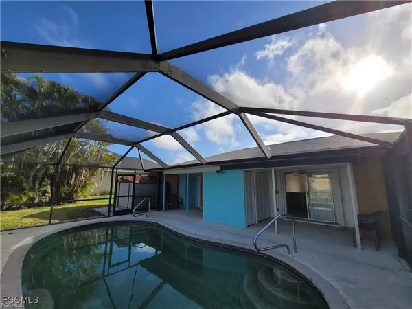 a view of a swimming pool with a patio