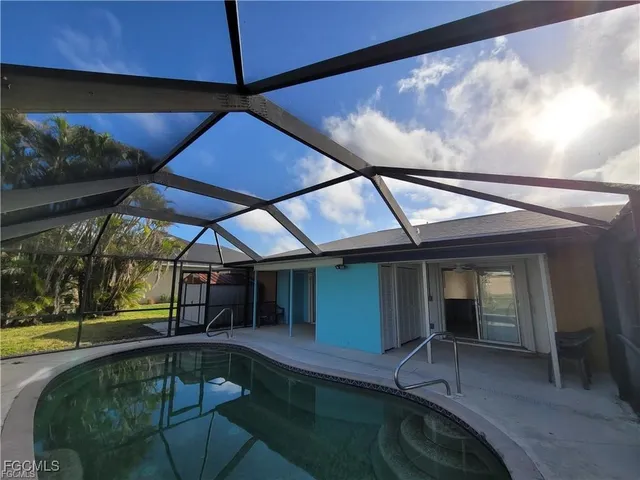 a view of a swimming pool with a patio