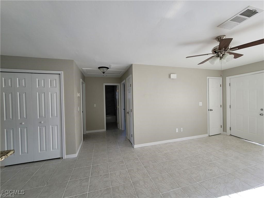 4530 Southwest 7th Place, Unit B Cape Coral, FL 33914 - Photo 6 of 18 a view of an empty room with a ceiling fan