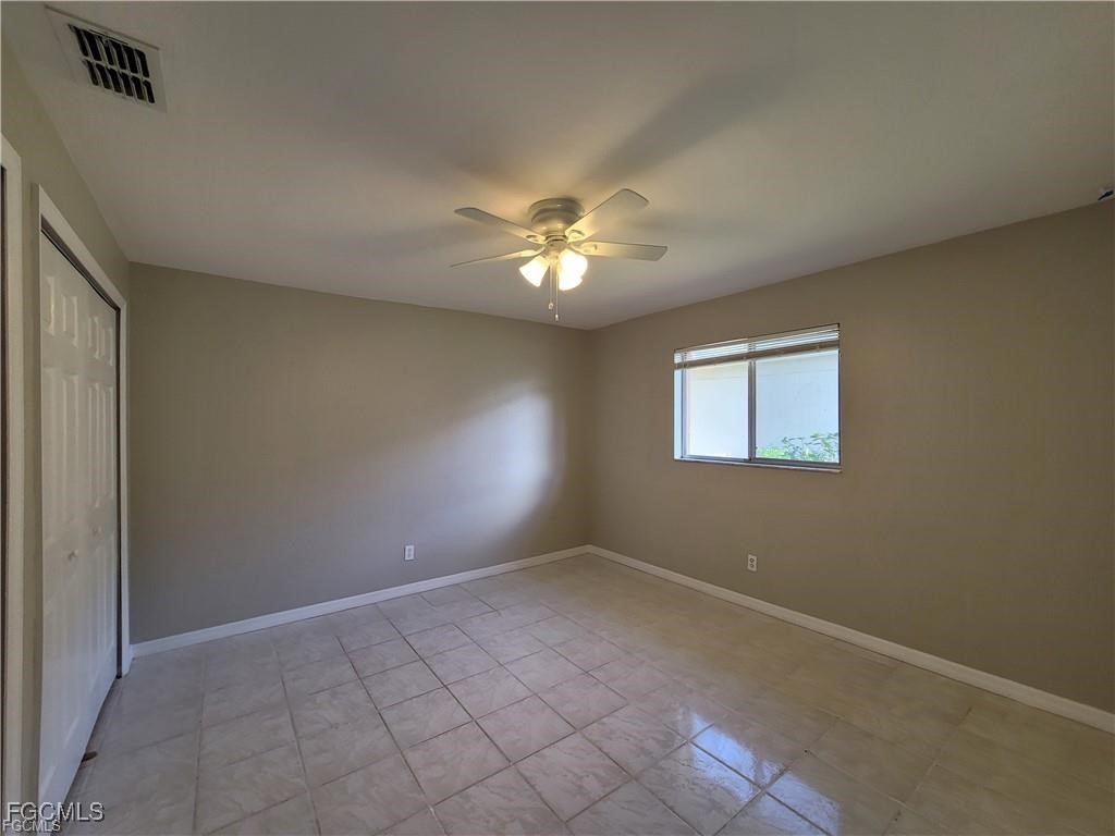 4530 Southwest 7th Place, Unit B Cape Coral, FL 33914 - Photo 7 of 18 a view of an empty room with a window