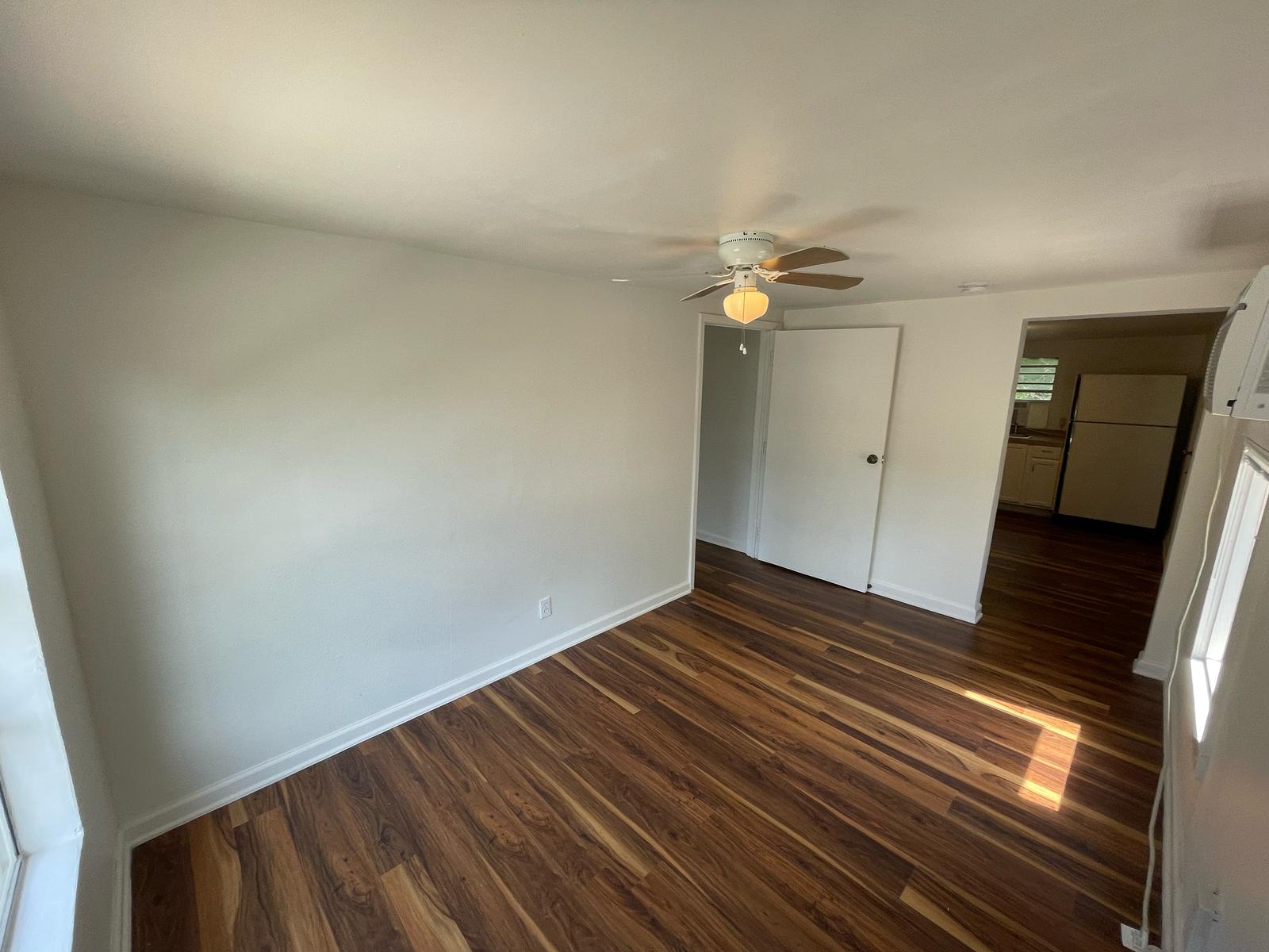6404 Ponca Street, Unit B Austin, TX 78741 - Photo 6 of 17 a view of an empty room and wooden floor