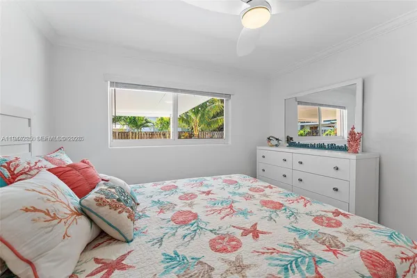 a bedroom with a bed and a window in it