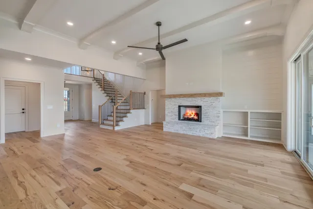 a bathroom with a bathtub a mirror and a sink