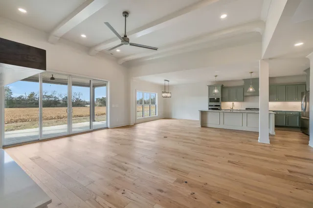 a bathroom with a sink mirror and toilet