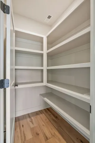 a view of swimming pool is middle in the garden