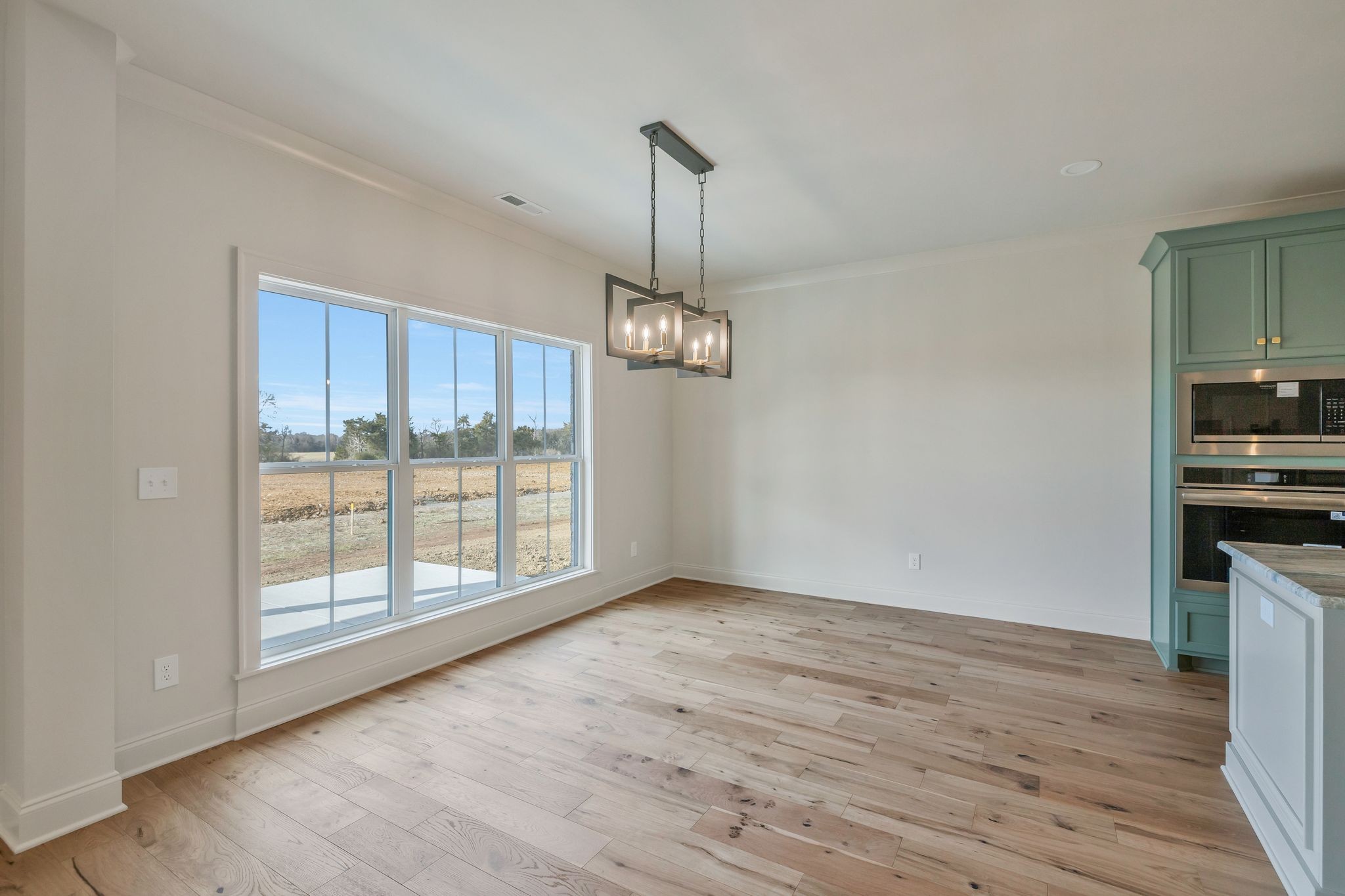 5548 Sinclair Street Murfreesboro, TN 37127 - Photo 24 of 58 a view of an empty room with wooden floor and a window