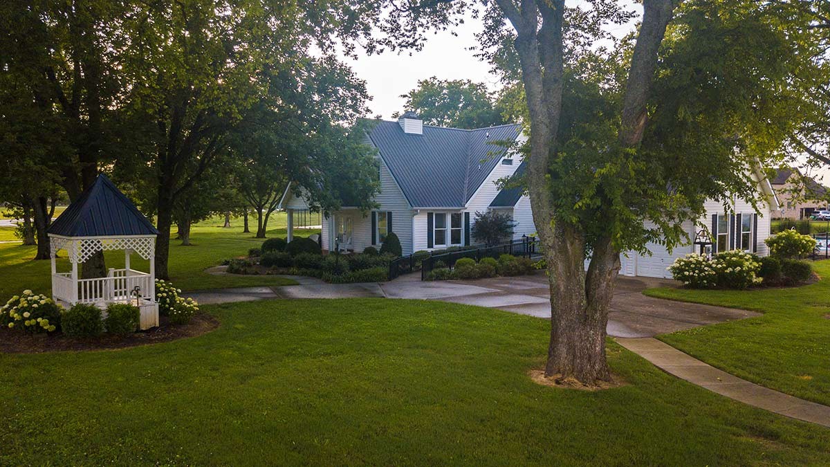 5548 Sinclair Street Murfreesboro, TN 37127 - Photo 52 of 58 a front view of a house with a yard garden and trees