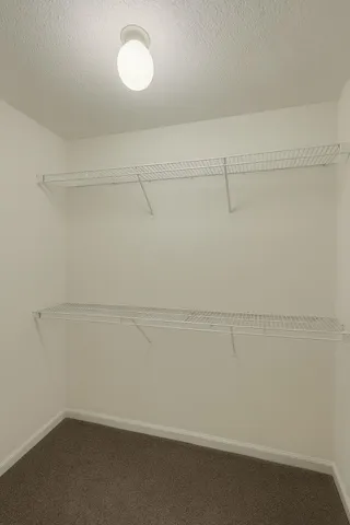 a view of a room with racks on the wall