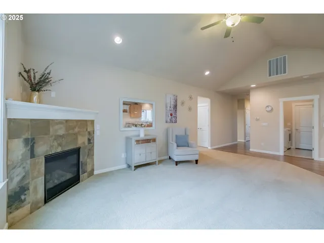 a view of empty room with a fireplace