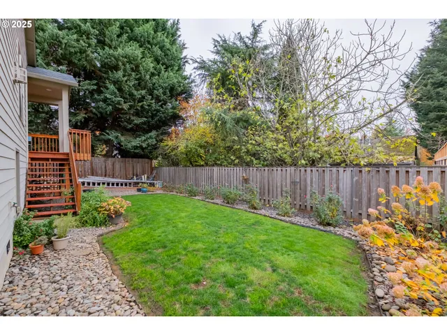 a garden with trees in the background