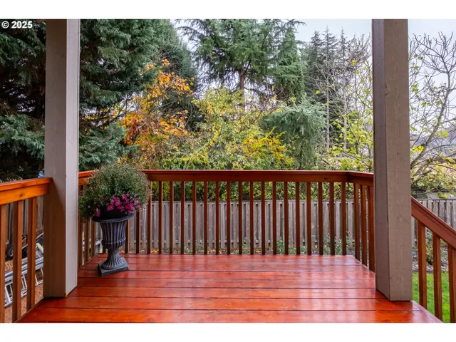 a view of a balcony with wooden floor