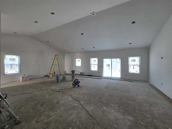 a view of empty room with a fireplace