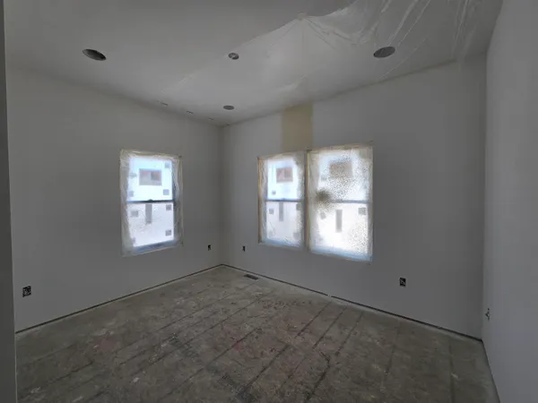 a view of empty room with windows