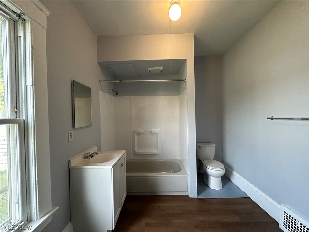 3403 Fulton Road, Unit DOWN Cleveland, OH 44109 - Photo 13 of 18 Full bathroom with vanity, toilet, hardwood / wood-style flooring, and shower / tub combination