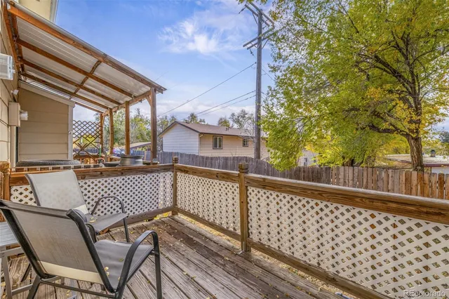a view of a chair and tables in the balcony