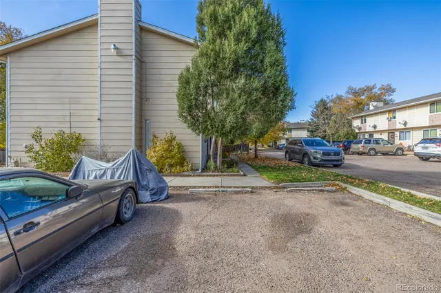 a view of a street with cars on road