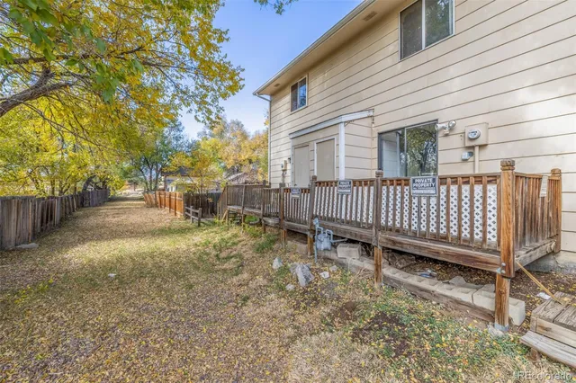 a view of a yard with swing and a swing