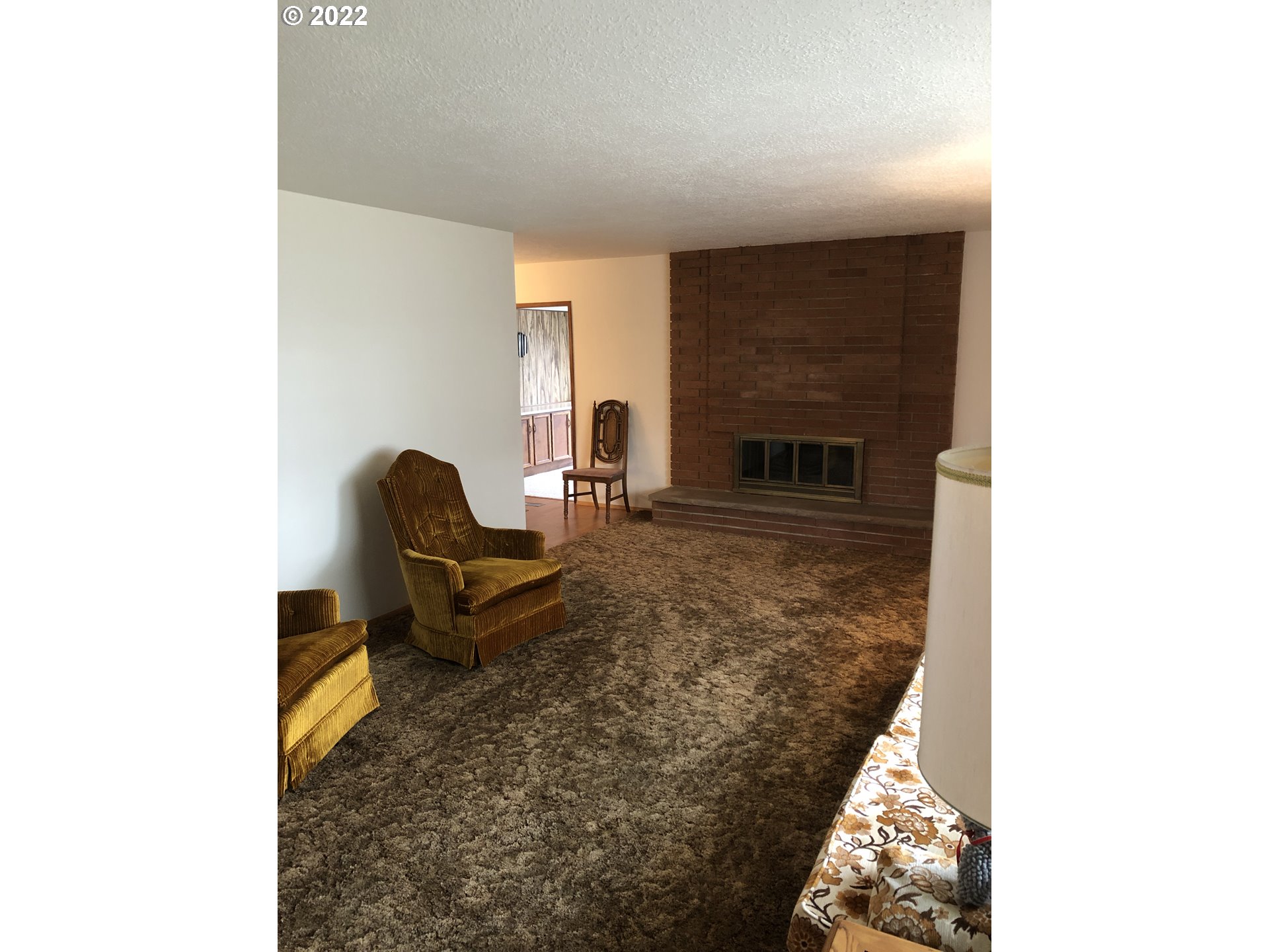 2806 Southwest Goodwin Avenue Pendleton, OR 97801 - Photo 16 of 32 a living room with furniture and a fireplace