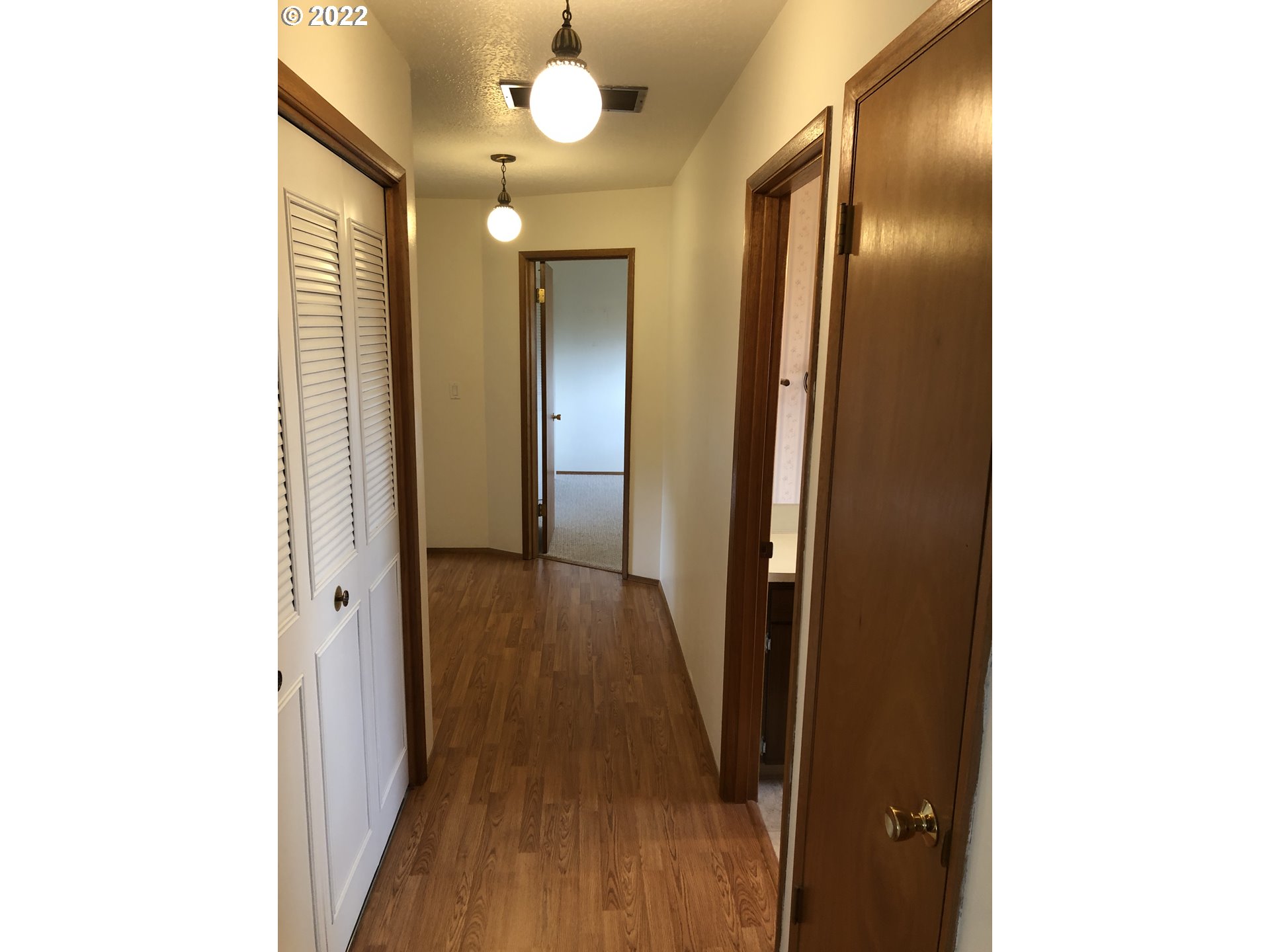 2806 Southwest Goodwin Avenue Pendleton, OR 97801 - Photo 17 of 32 a view of a hallway with wooden floor