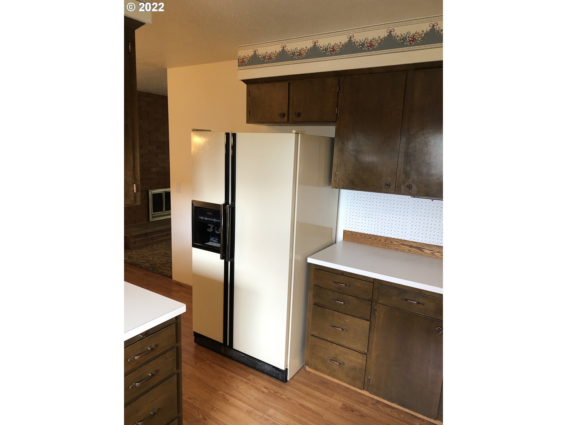 2806 Southwest Goodwin Avenue Pendleton, OR 97801 - Photo 8 of 32 a kitchen with a refrigerator and cabinets