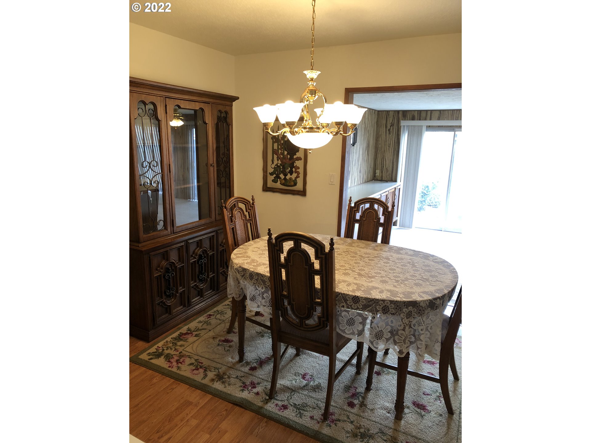 2806 Southwest Goodwin Avenue Pendleton, OR 97801 - Photo 10 of 32 a dining room with furniture and a chandelier