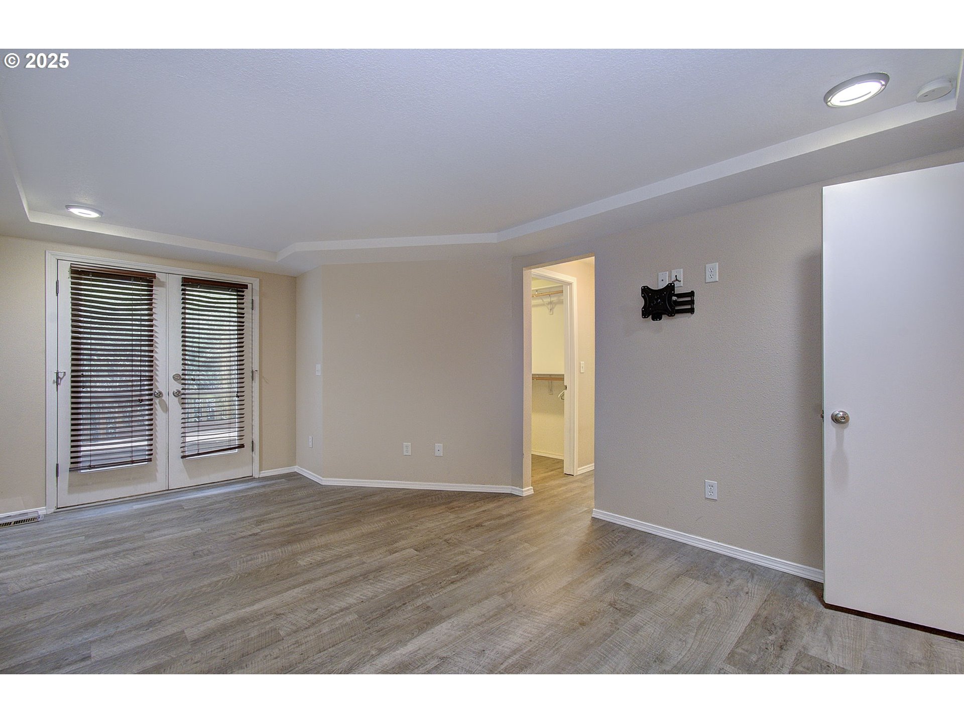 1402 Northwest 30th Avenue Camas, WA 98607 - Photo 22 of 33 a view of an empty room with wooden floor and a window