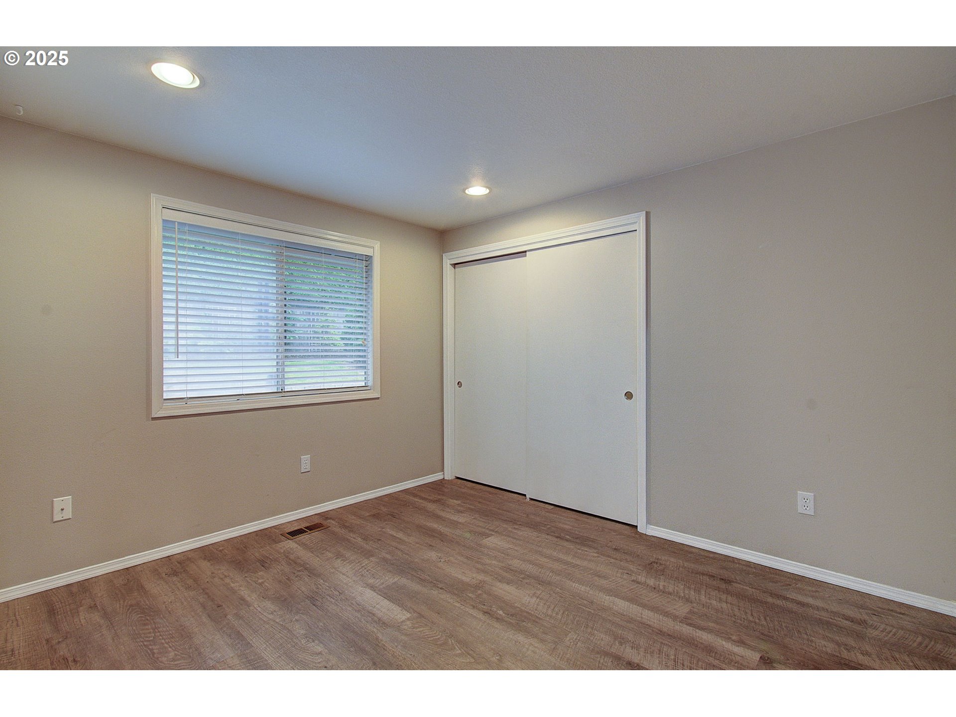 1402 Northwest 30th Avenue Camas, WA 98607 - Photo 28 of 33 a view of an empty room with wooden floor and a window