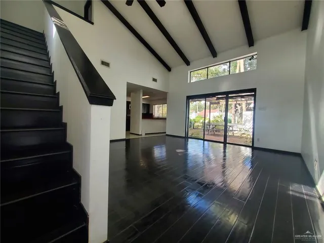 a view of an entryway with wooden floor