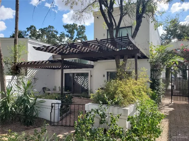 a view of a house with a garden