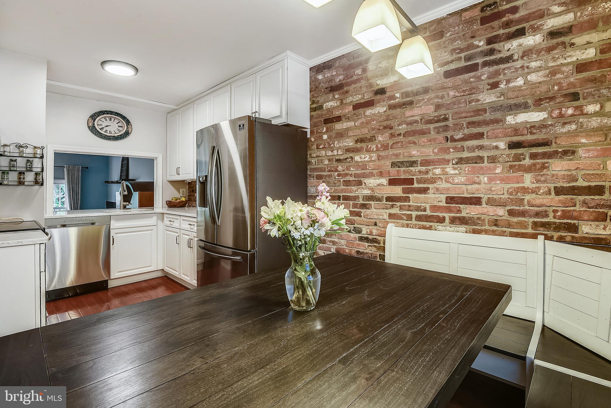 5935 Bayshire Road, Unit 119 Springfield, VA 22152 - Photo 8 of 32 Warmth of natural brick in the heart of the home