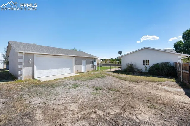 a house view with a backyard space