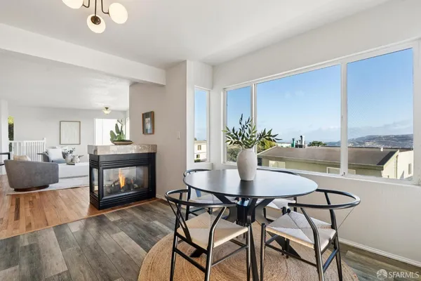 a view of a dining room with furniture window and outside view