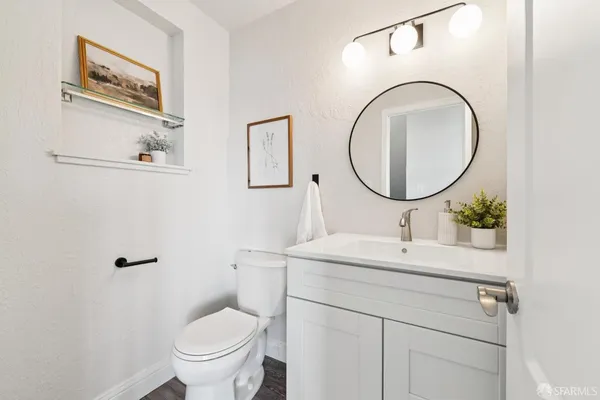 a bathroom with a sink mirror and a bathtub