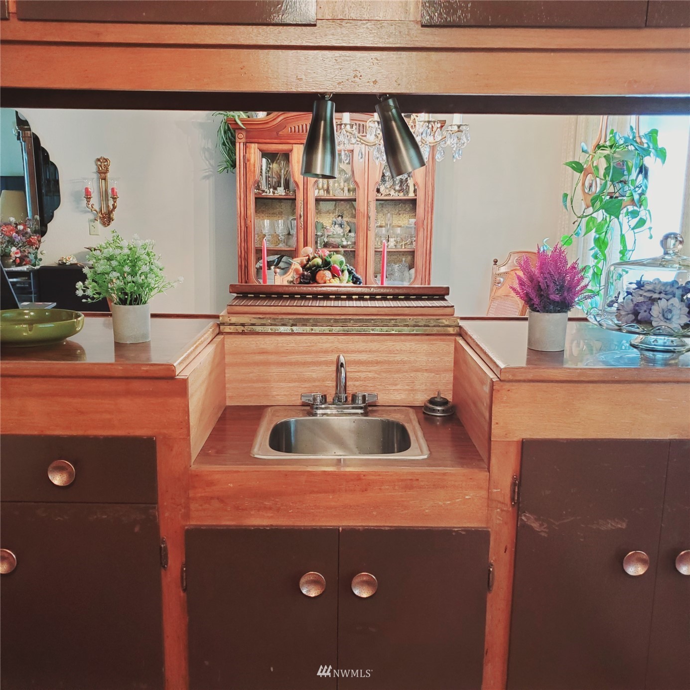15053 Southeast 113th Street Renton, WA 98059 - Photo 12 of 31 a kitchen with a sink and a stove with wooden floor